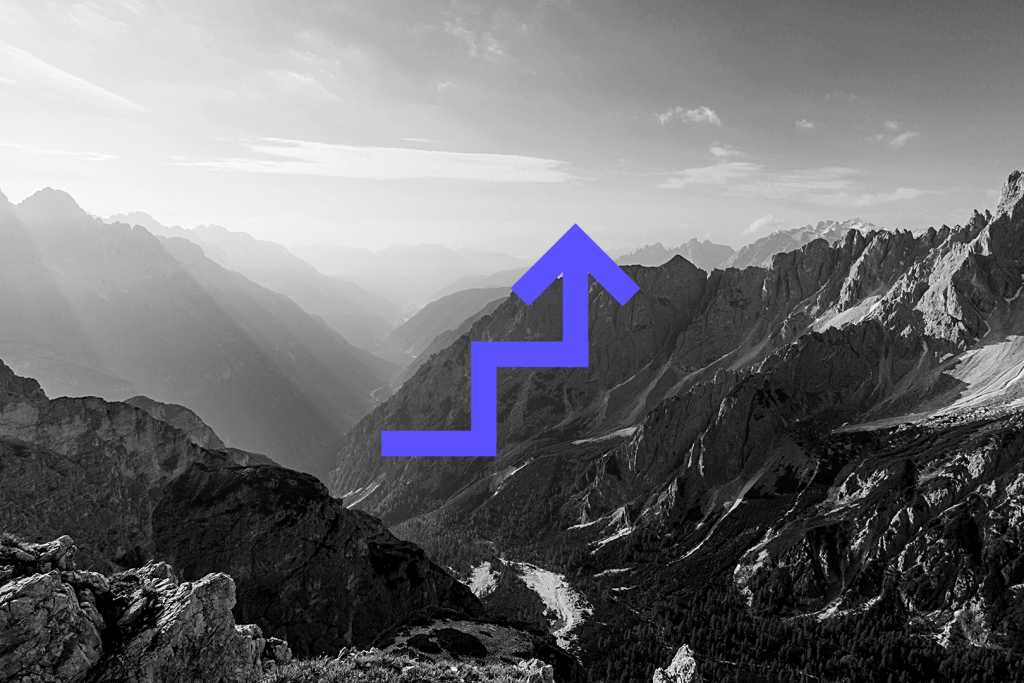 Mountains with blue up arrow
