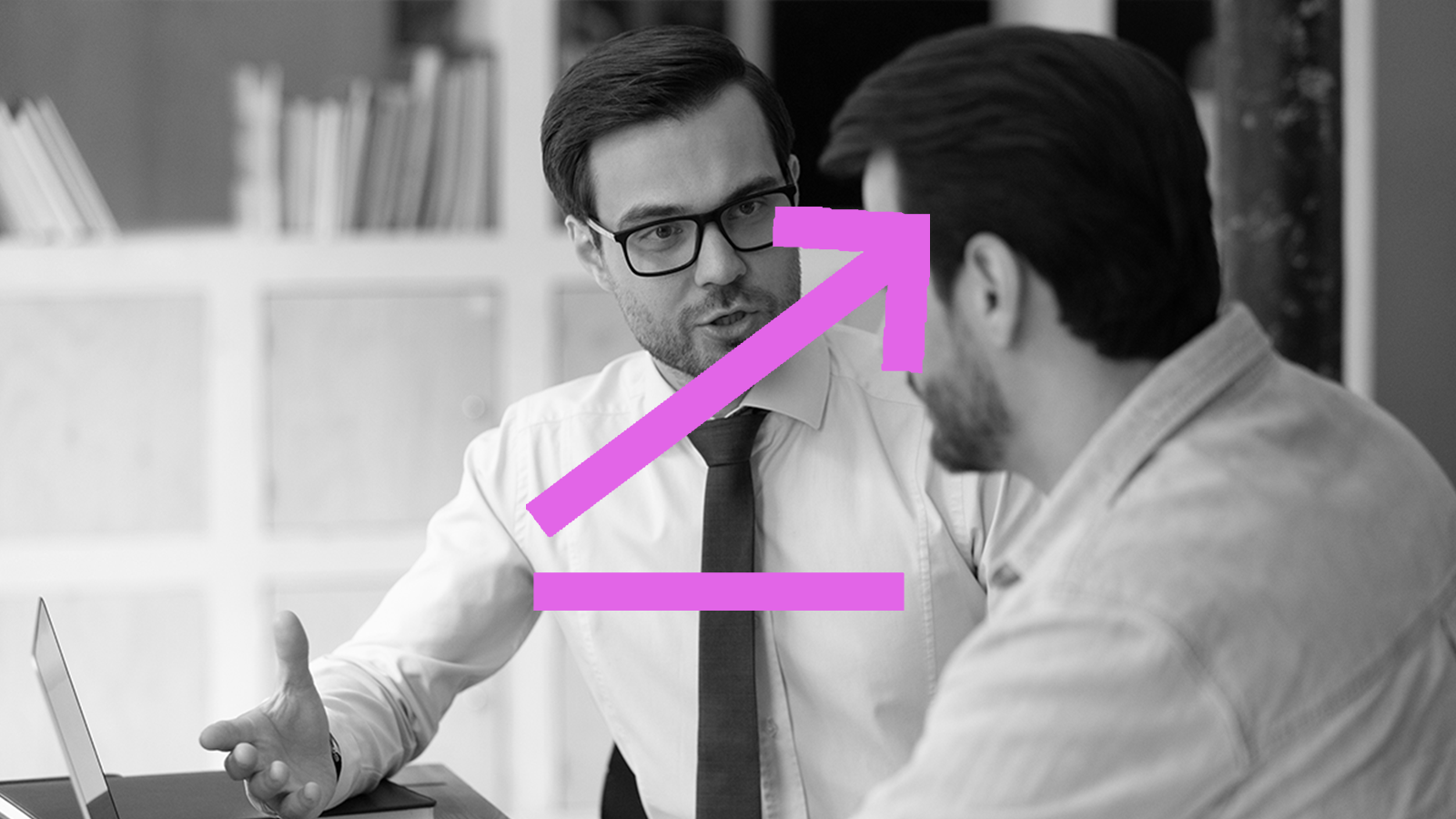 Man with glasses explaining with purple up arrow