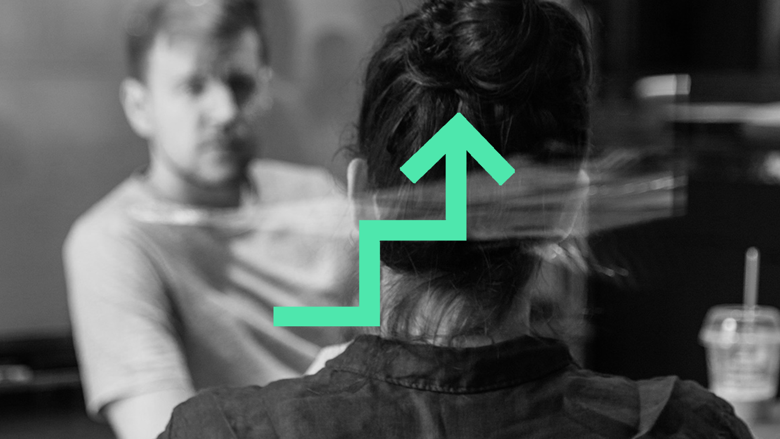 two people discussing with green up arrow